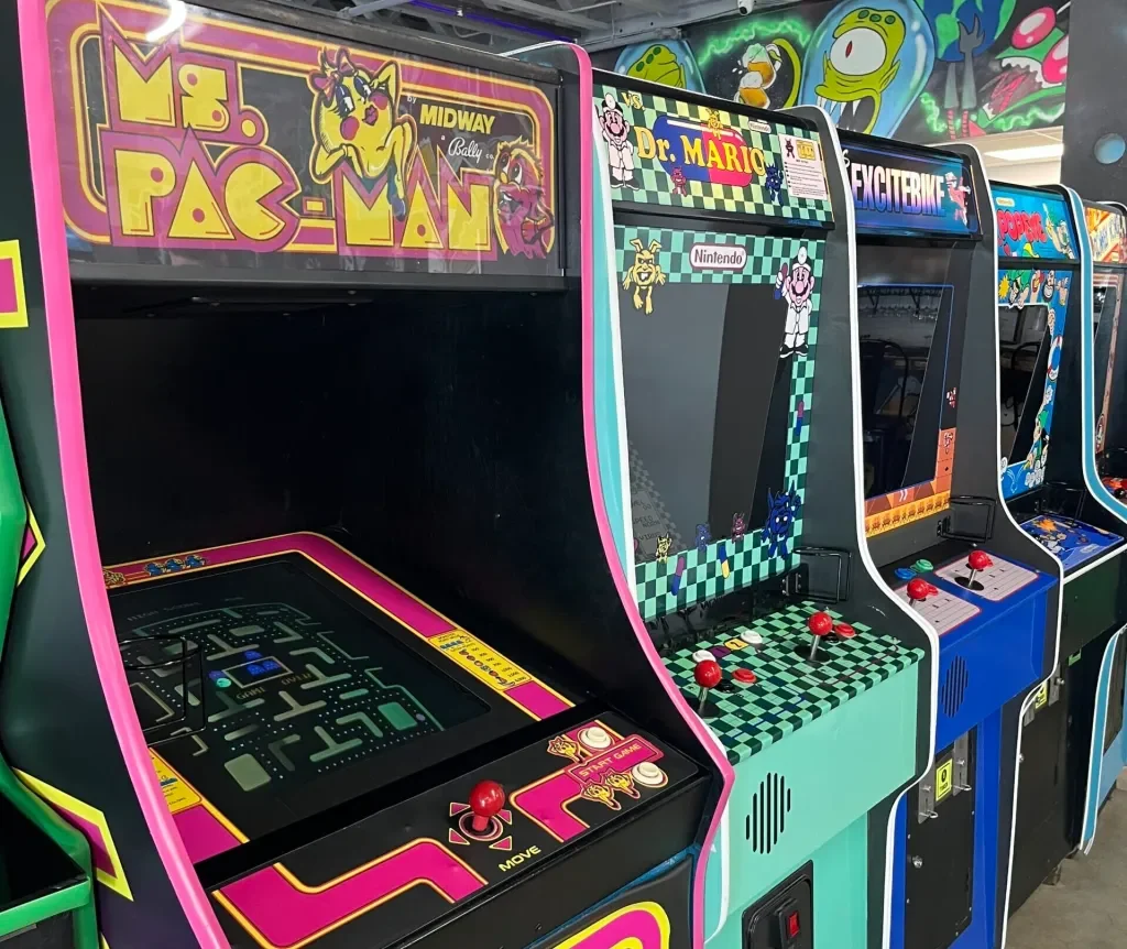 Ms. Pac-Man and Dr. Mario arcade cabinets inside Arcade 11