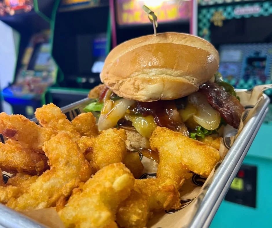 Burger and crispy sides photographed at Arcade 11