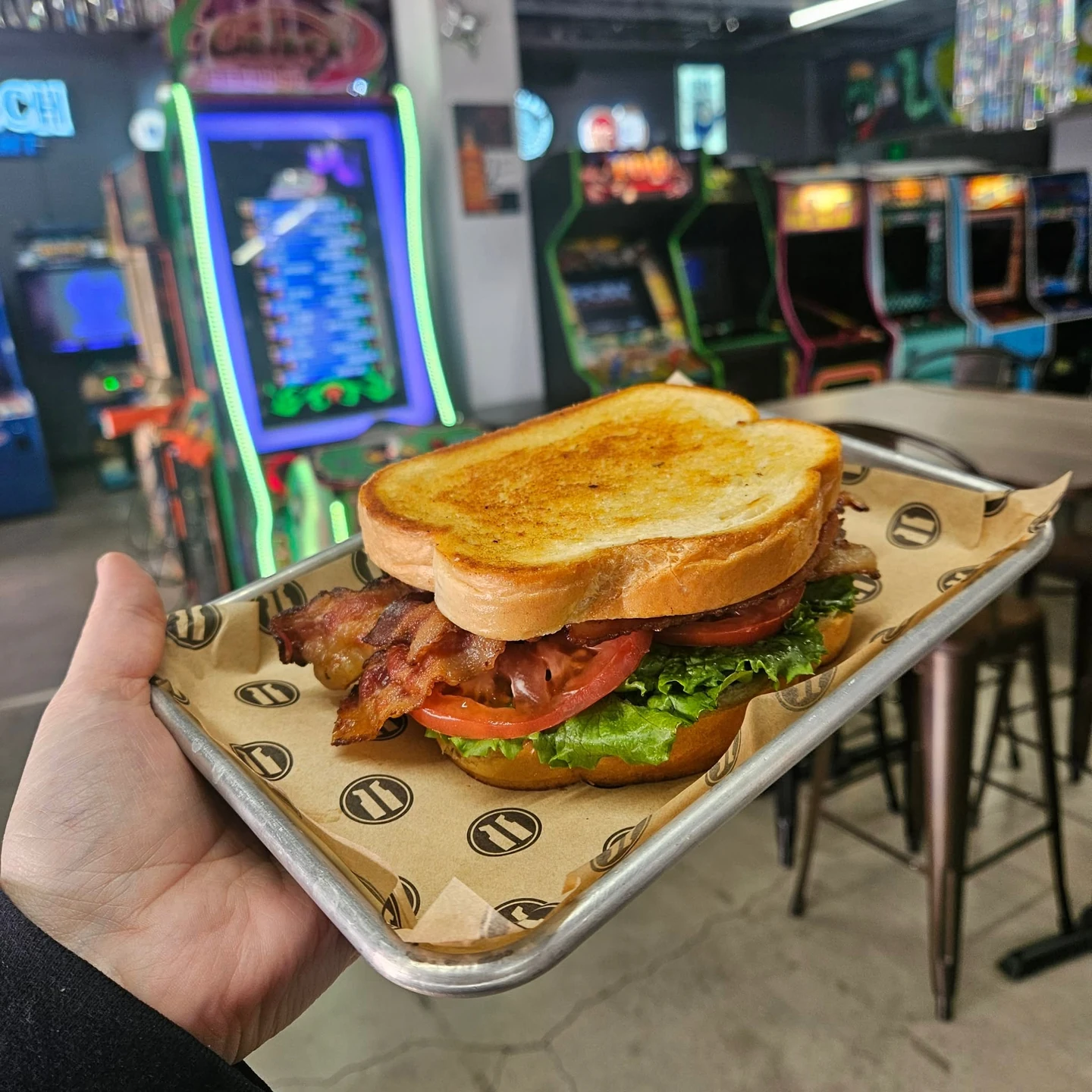 Toasted sandwich with bacon, lettuce and tomato photographed at Arcade 11
